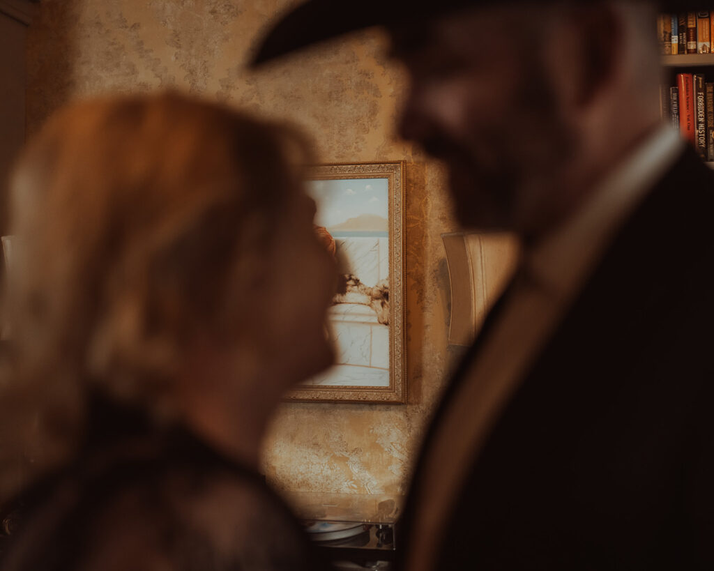 Details of a couple getting close inside the living room