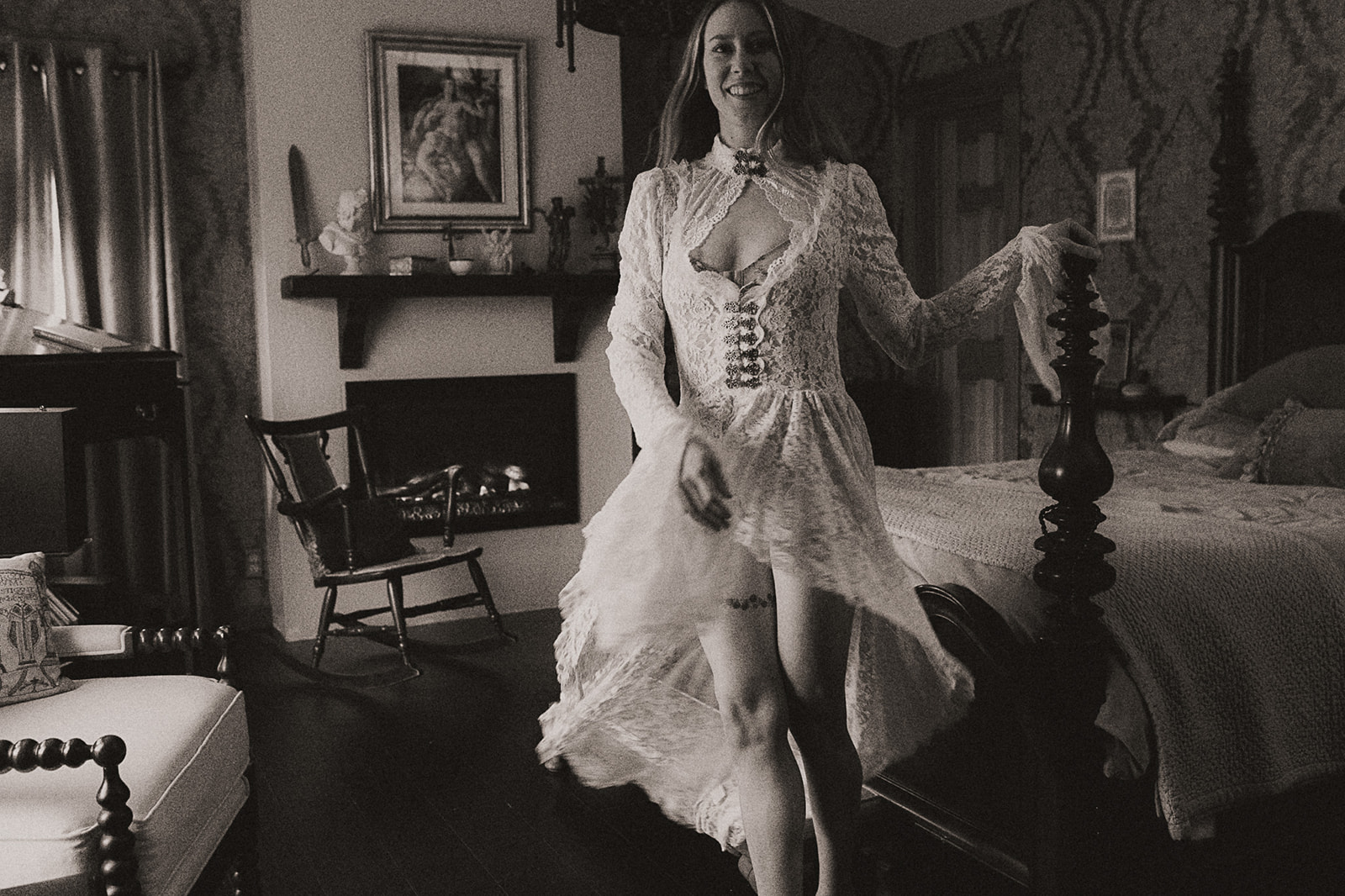 A woman in a lace dress smiles while dancing in an antique bedroom after visiting Med Spas in Kalispell
