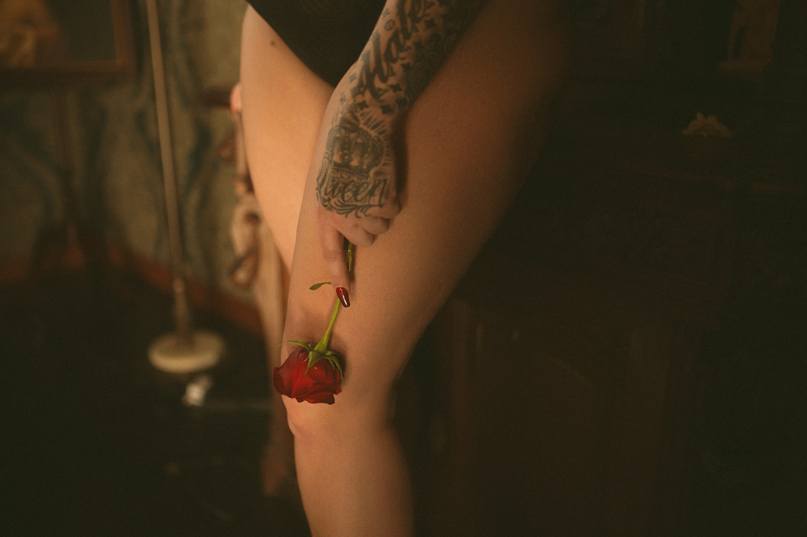 Details of a rose being held against a woman's leg after she found waxing in Missoula